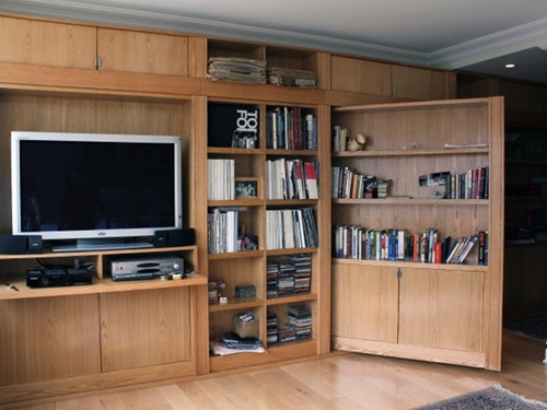 open bookcase door on entertainment center.