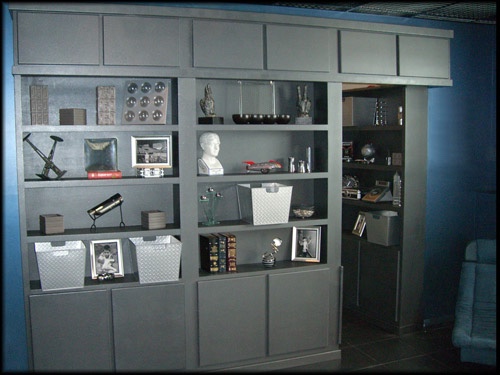Grey open bookcase door.