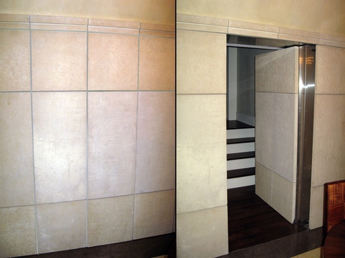 steel frame stone tiled high security door, open and closed.