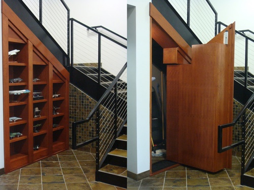 Under staircase bookcase door, open and closed