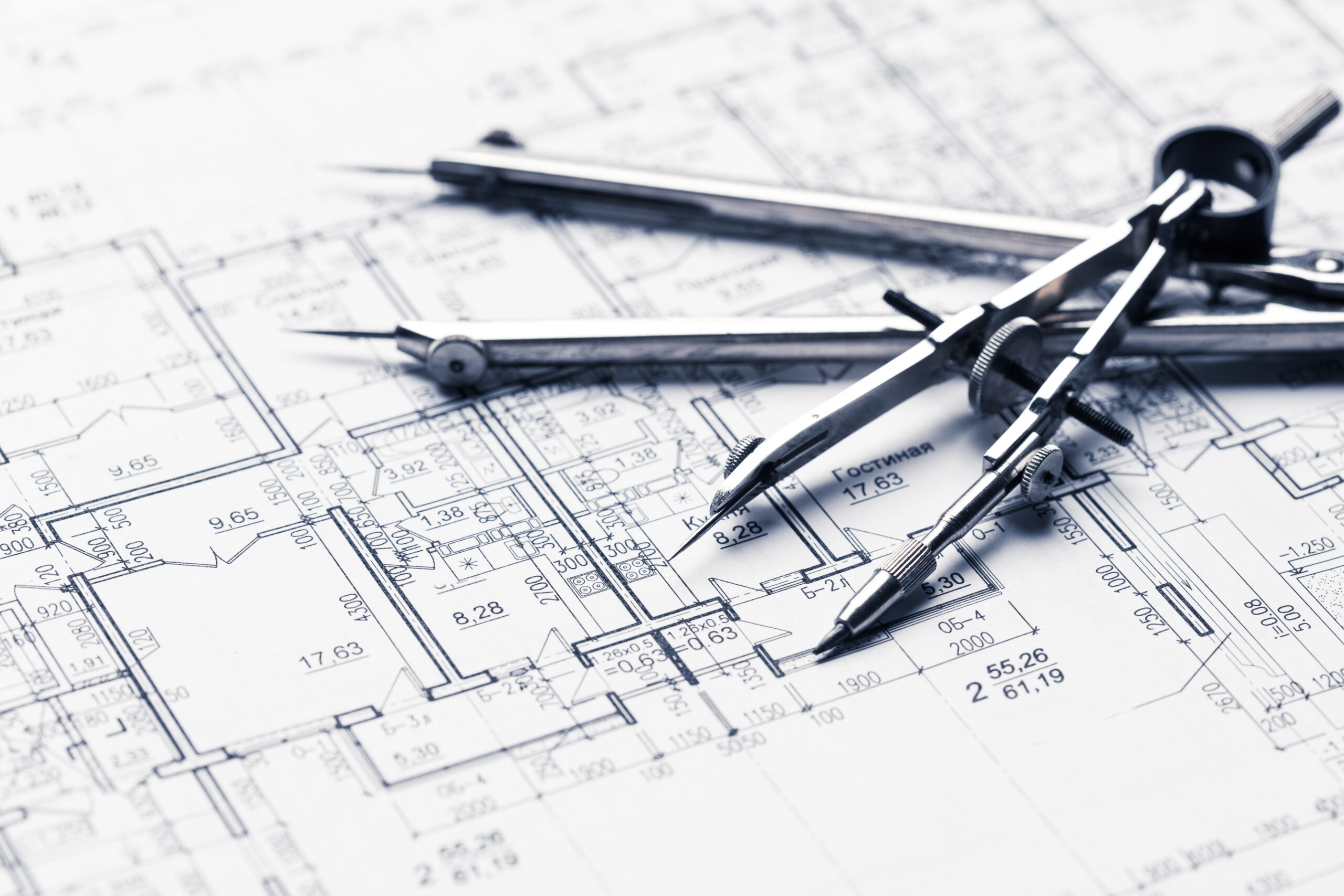 Architectural blueprints with drawing tools.