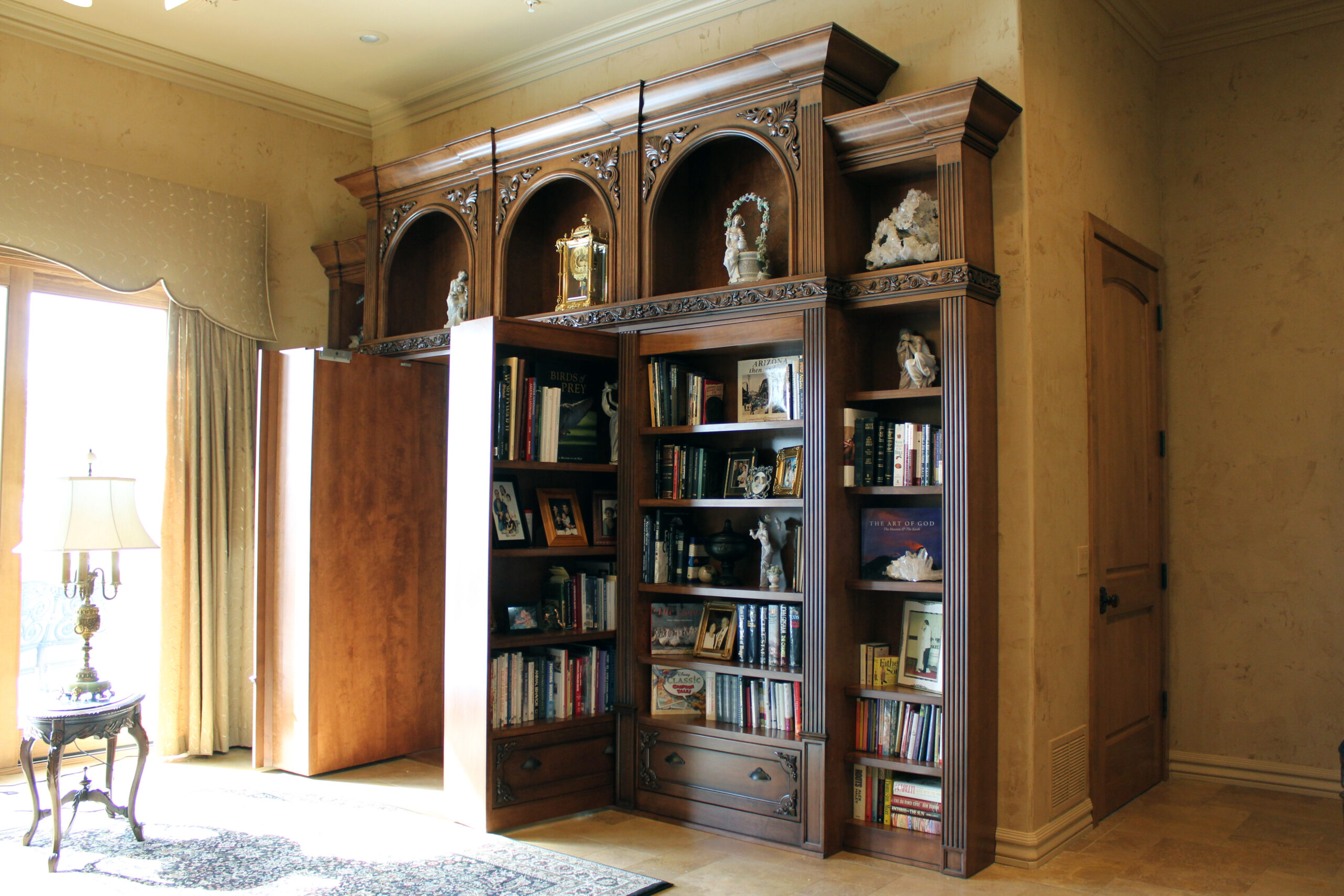 opened gun vault Bookcase hidden door