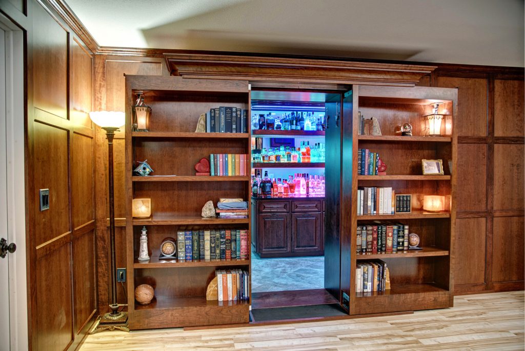 open sliding bookcase with double doors