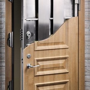  Cross-section of a high-security wooden door showing reinforced steel interior and locking mechanisms. Embassy Series. 
