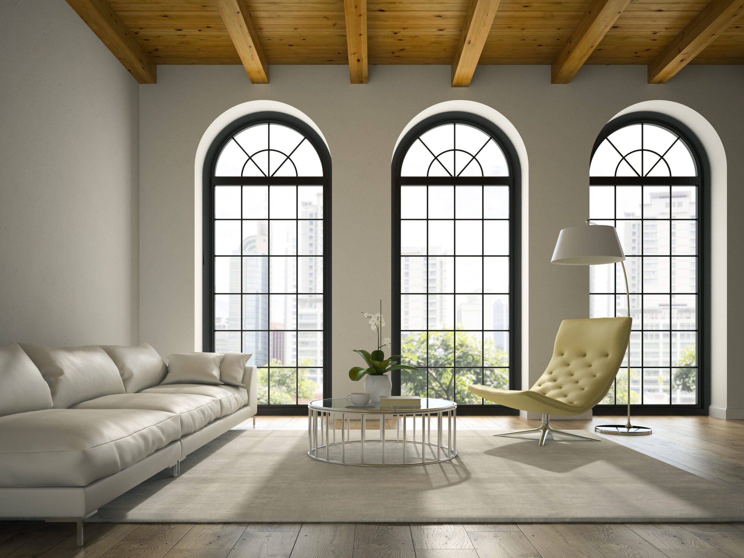 Modern living room with arched black-framed windows, exposed wood ceiling beams, neutral furniture, and natural light