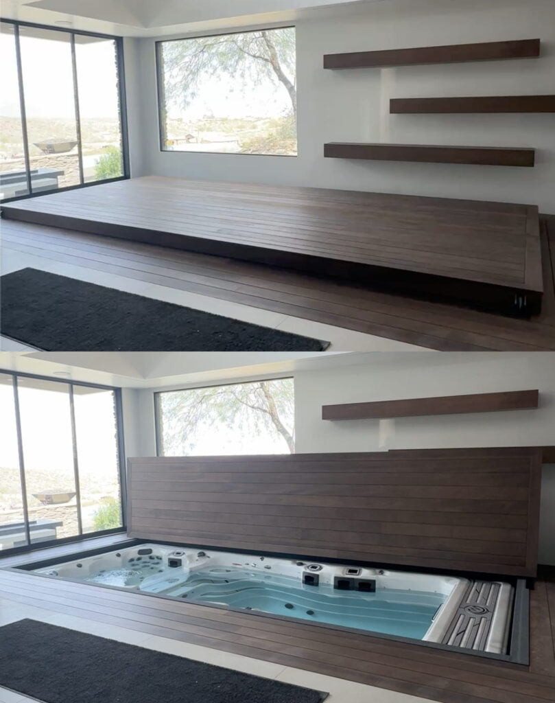 Two photos: The top shows a wooden platform in a modern room. The bottom reveals the platform partially lifted, exposing a hidden hot tub beneath it. Large windows and wall shelves are in the background.