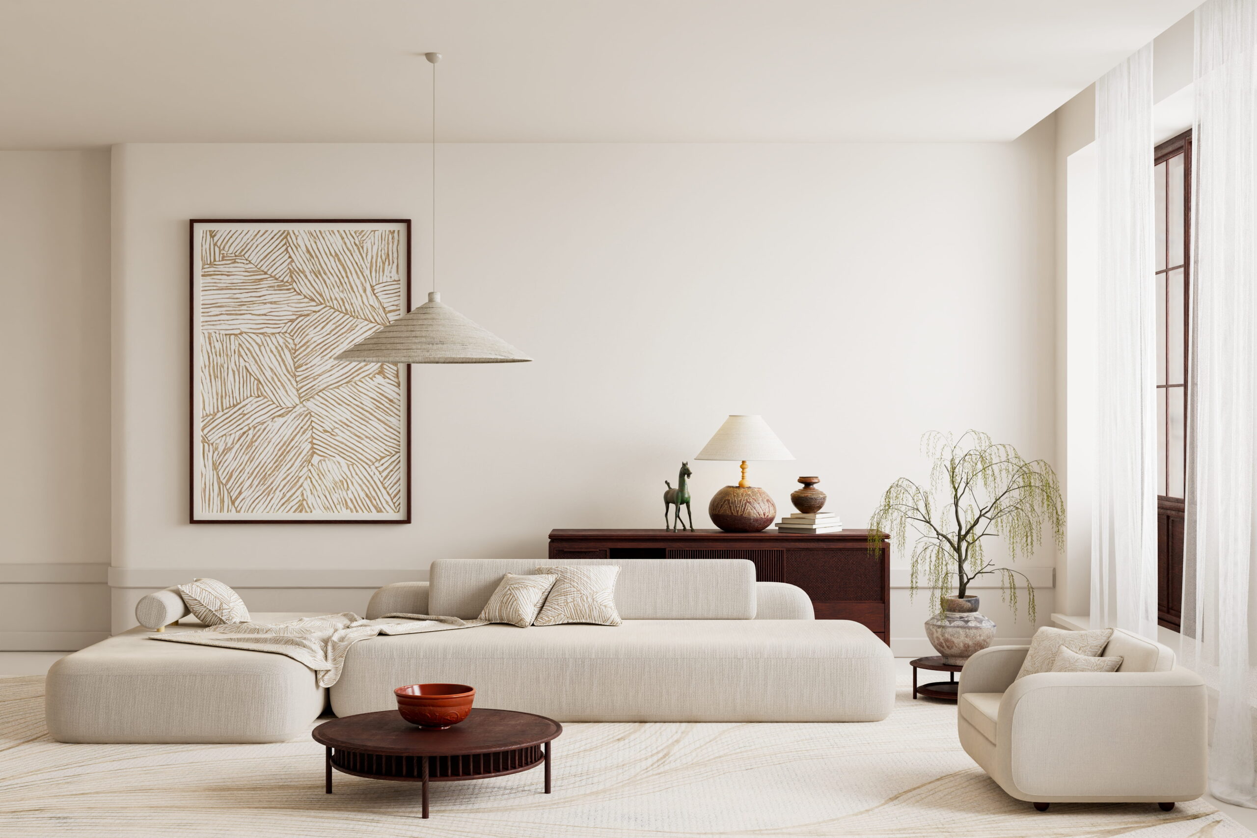 Modern living room with cream sofas, a round wooden coffee table, large abstract wall art, a sideboard with decor, a potted plant, and sheer curtains on tall windows. Neutral tones create a calm, minimalist look.